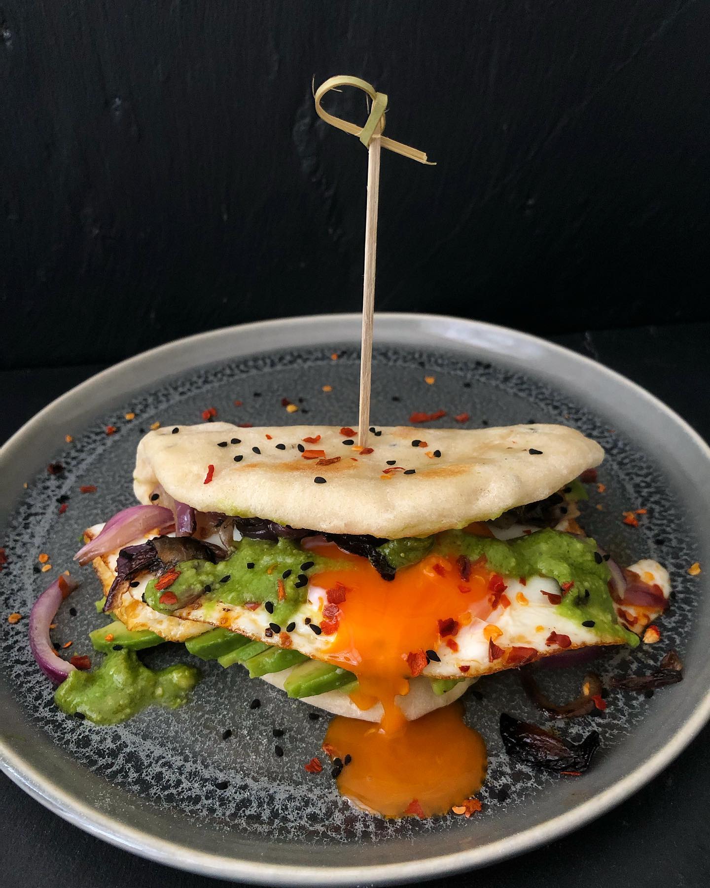 Breakfast Naan with Avocado, Chilli Oil Fried Egg, Crispy Fried Onion, and Green Chutney