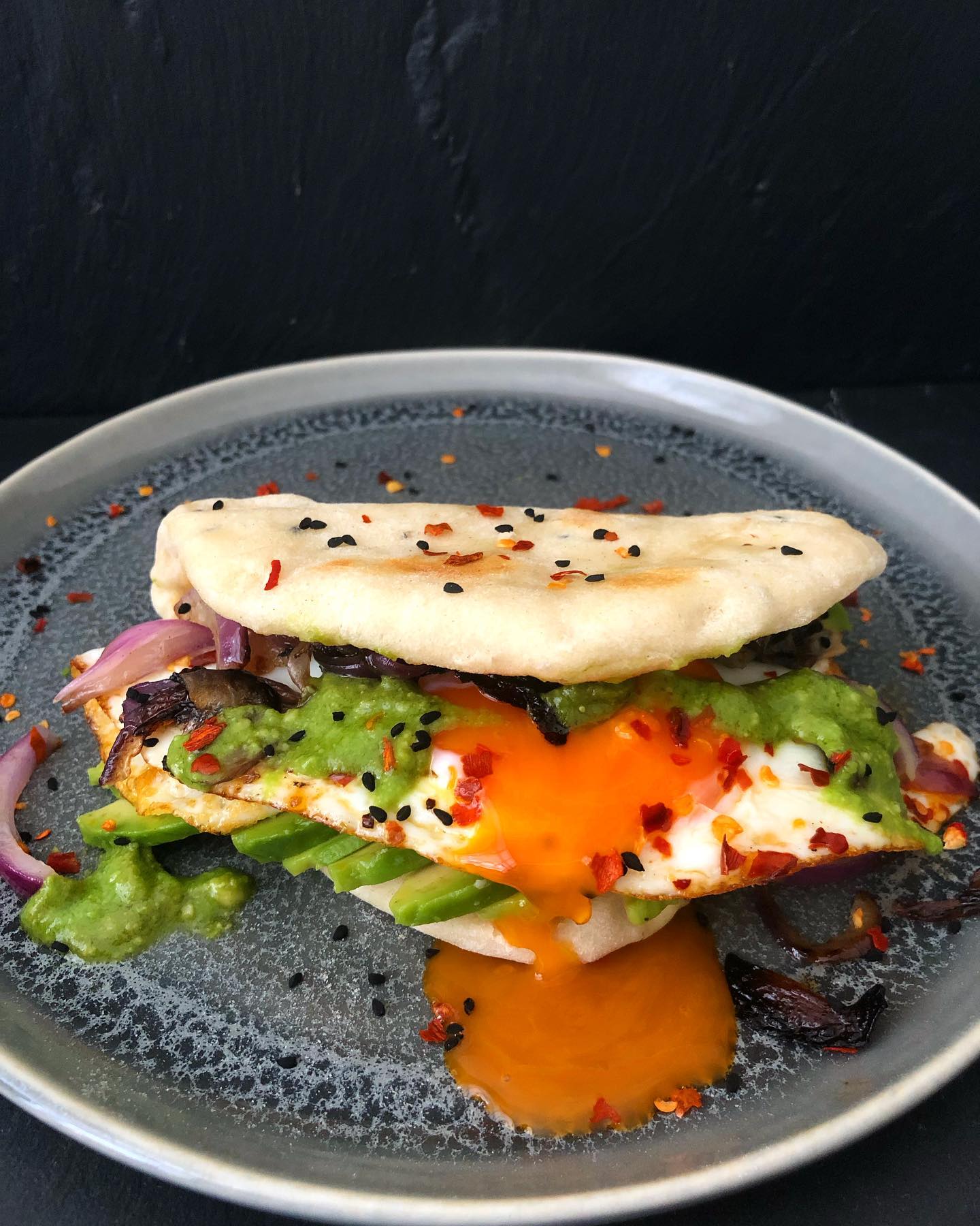 Breakfast Naan with Avocado, Chilli Oil Fried Egg, Crispy Fried Onion, and Green Chutney