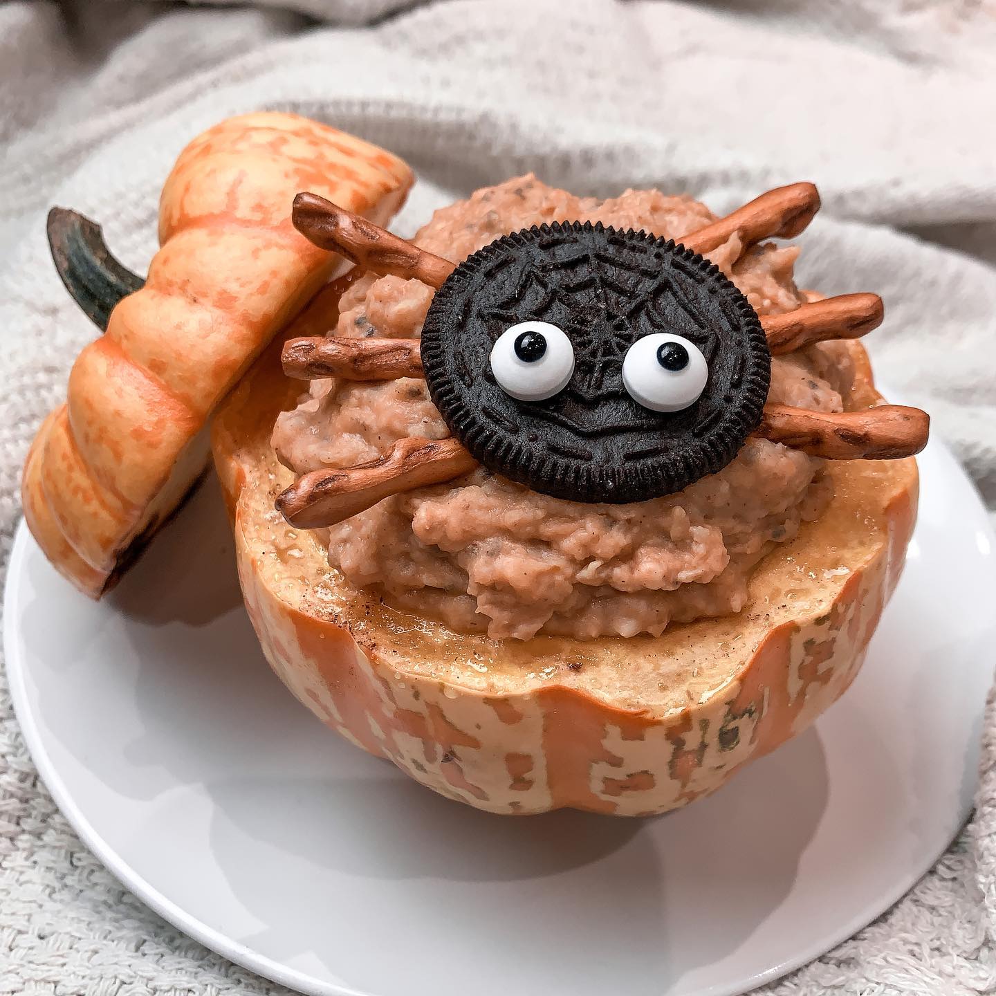 Pumpkin Oatmeal with Spooky Oreo and Pretzel Toppings