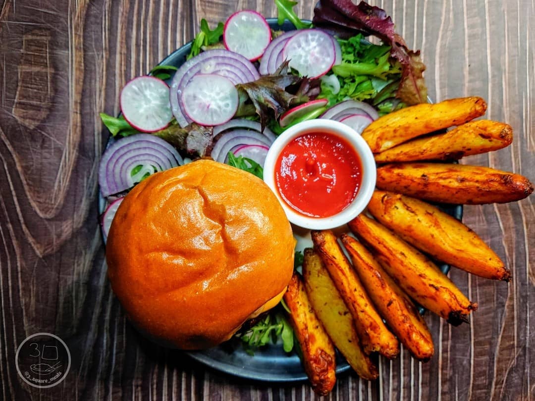 Quorn Quarter Pounder with Wedges and Caramelized Onions