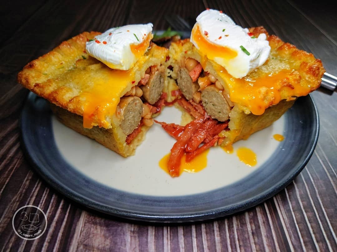 Breakfast Pie with Pasta Pastry, Sausages, Bacon, Beans, and Poached Egg