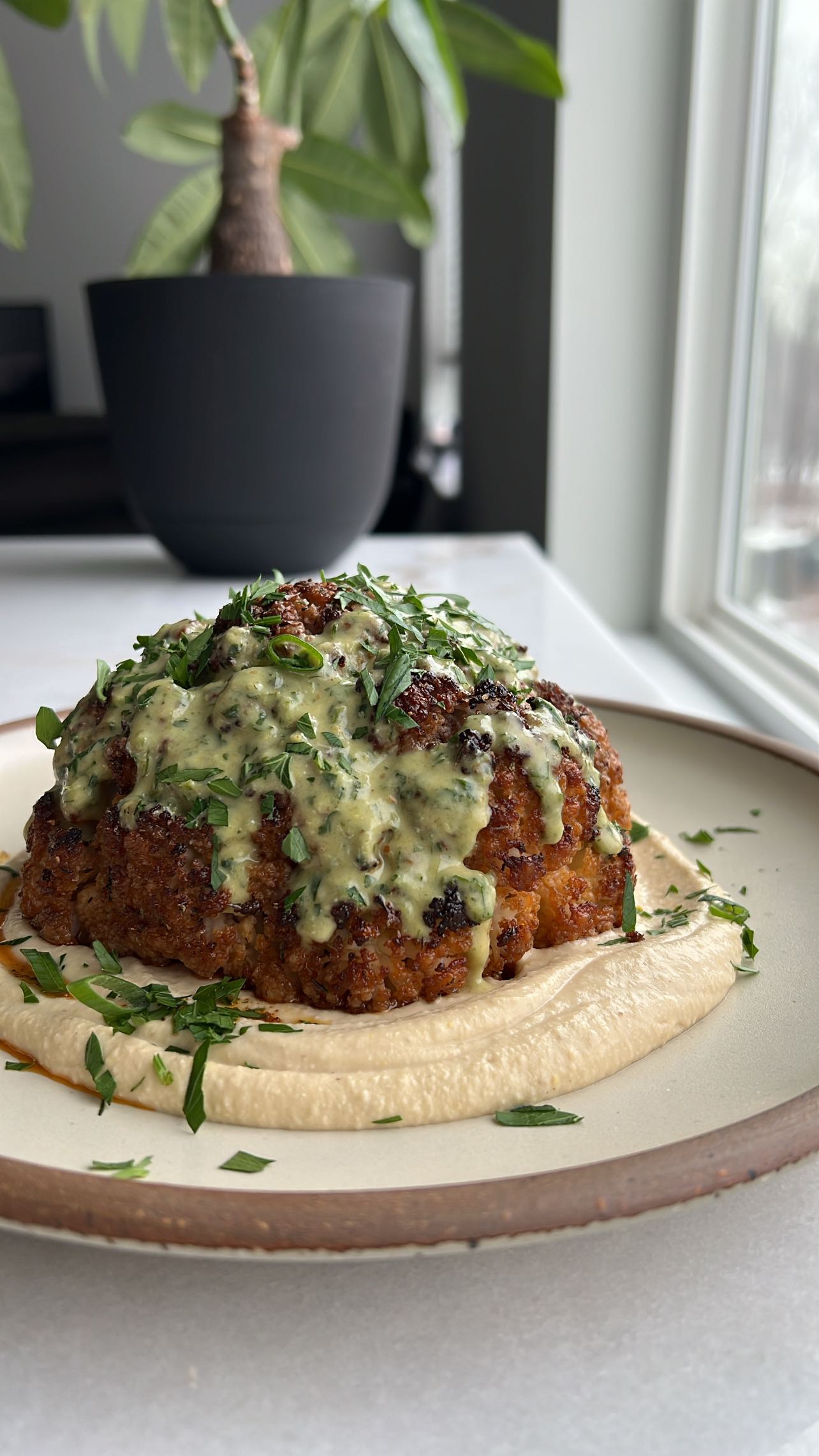 Whole Roasted Cauliflower with Scallion Date Dressing