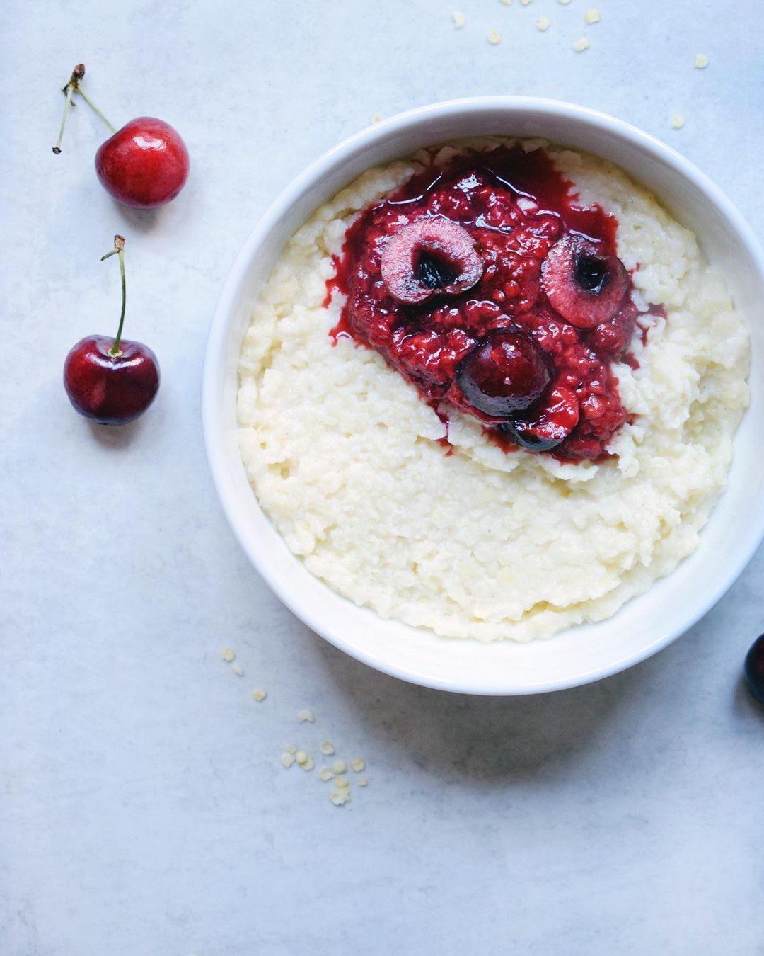 Creamy Millet Porridge with Quick Berry Sauce for Breakfast