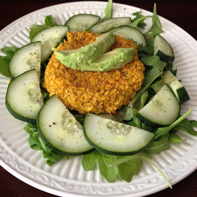 Pumpkin White Bean Quinoa Burger on a Bed of Arugula, Cucumber & Avocado