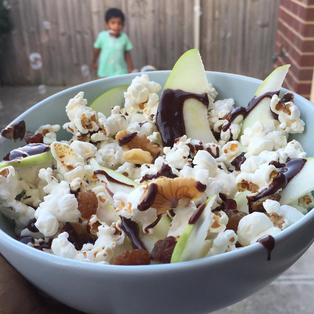Healthy Popcorn Snack with Fruit and Chocolate Drizzle