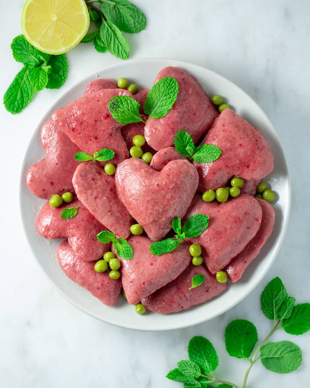 Ricotta Beet Raviolis with Lemon Butter, Mint, and Peas