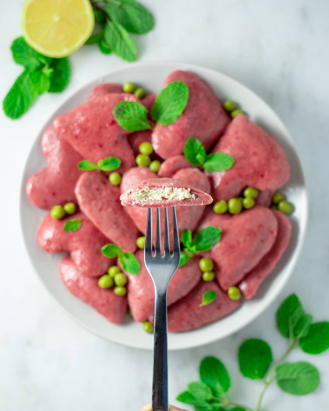 Ricotta Beet Raviolis with Lemon Butter, Mint, and Peas