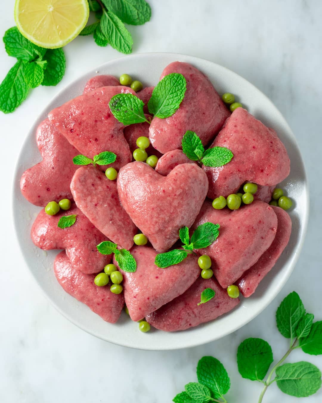 Ricotta Beet Raviolis with Lemon Butter, Mint, and Peas