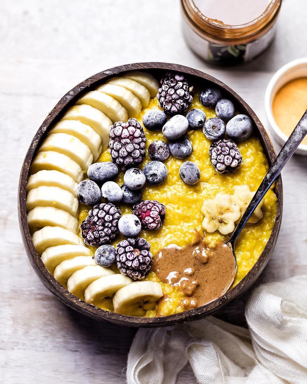 Golden Oatmeal Bowl with Berries, Banana, and Almond Butter