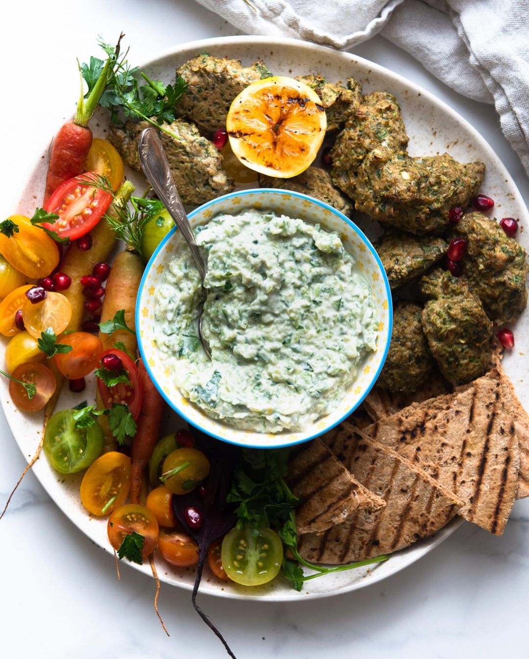 Snack Plate Made with Vegan Tzatziki, Lentil Kebabs and Chopped Salad
