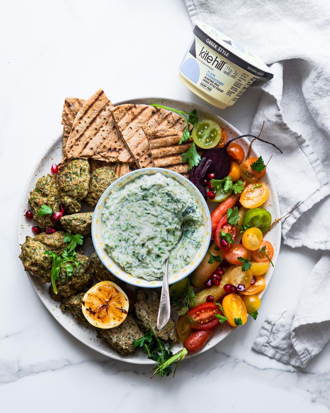Snack Plate Made with Vegan Tzatziki, Lentil Kebabs and Chopped Salad